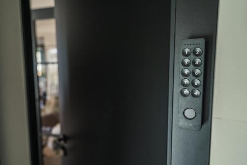 a close up of a door with a remote control at Chalet Bergblick Suites - Luxury Escape in Bad Kleinkirchheim