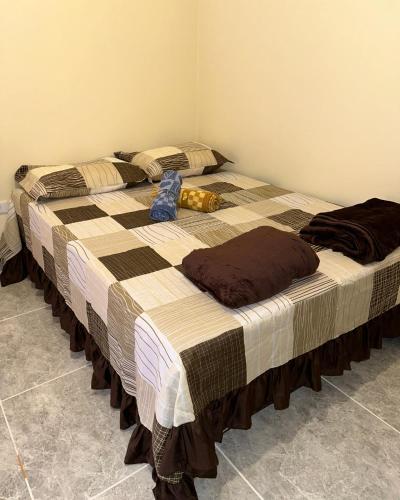 two beds sitting in a room with at Espaço R&R 2 in São Roque