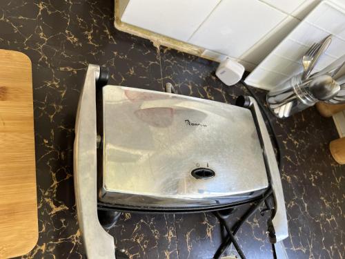 a sink on a counter in a kitchen at Nairobi Deluxe Apartment 15 min to JKIA, 30min to CBD in Nairobi