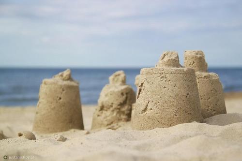 a group of sand castles on the beach at Comfortable holiday home with sauna and whirlpool in Lubin