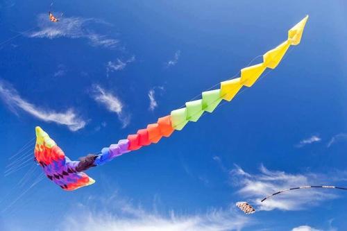 a colorful kite flying in the sky at Comfortable holiday home with sauna and whirlpool in Lubin