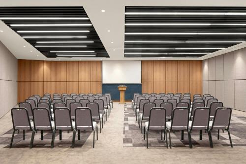 a conference room with chairs and a podium at Four Points by Sheraton Istanbul Pendik in Istanbul