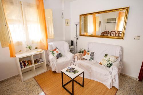 Ένα ή περισσότερα κρεβάτια σε δωμάτιο στο Piso Turístico Noches de Palacio en Jaén