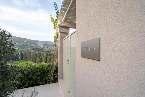 a sign on the side of a building at SuiteHome Villas with Private Pools by Explore Andros in Andros