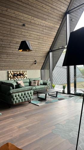 a living room with a couch and a table at One & Only - Peace For You, Zlatibor in Zlatibor