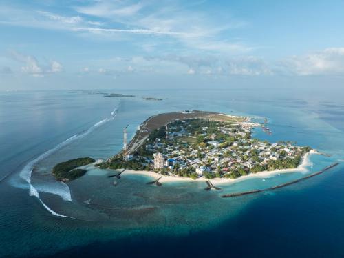 an island in the middle of the ocean at La Due Thulusdhoo in Thulusdhoo