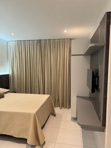 En eller flere senge i et værelse på Vila Eco BG