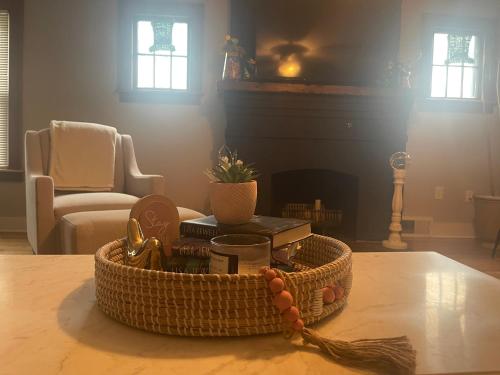 a basket of items on a table in a living room at Come home to Kenwood Conveniently located Syracuse in Syracuse