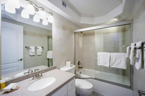 a bathroom with a sink and a toilet and a shower at Tamarind Bay # 16 in Grand Cayman