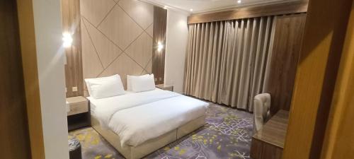 Cama o camas de una habitación en أبها ريجنسي Abha Regency