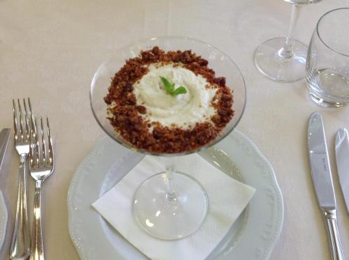 a bowl of food on a plate on a table at Domus Australia in Rome