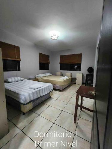 Ένα ή περισσότερα κρεβάτια σε δωμάτιο στο Villa Fluvia Rafaela
