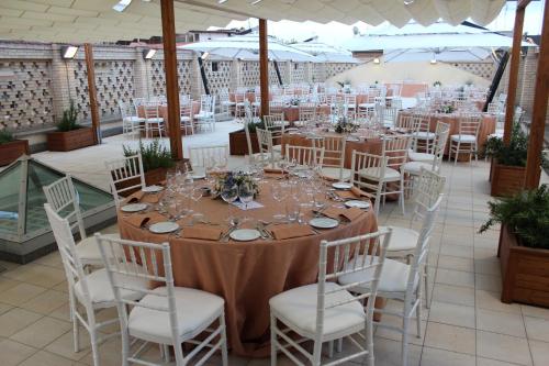 a table set up for a wedding in a marquee at Domus Australia in Rome