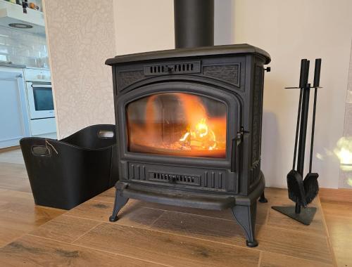 a stove sitting on top of a wooden floor at Blanka10 in Blankaholm