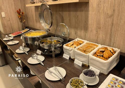 a buffet line with pastries and other food on a table at Hoteles Paraiso PIURA in Piura