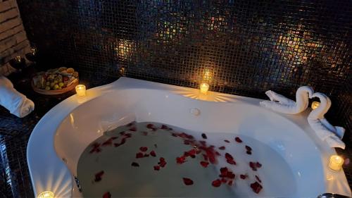 a bath tub with some food in it with candles at SANTA CECILIA LA MORA HUASCA in Huasca de Ocampo