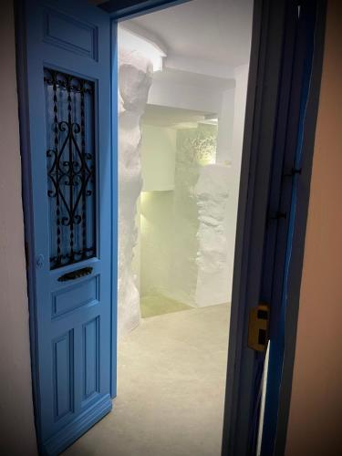 an open door to a room with a wall at Casa Alta 22 in Frigiliana