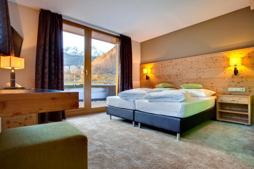Postel nebo postele na pokoji v ubytování Hotel Bäckelar Wirt Superior