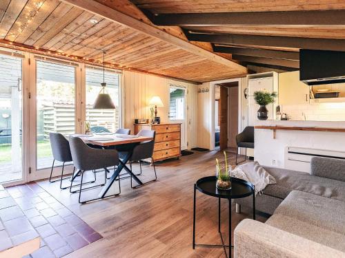 a living room with a couch and a table at 4 star holiday home in Hals in Hals