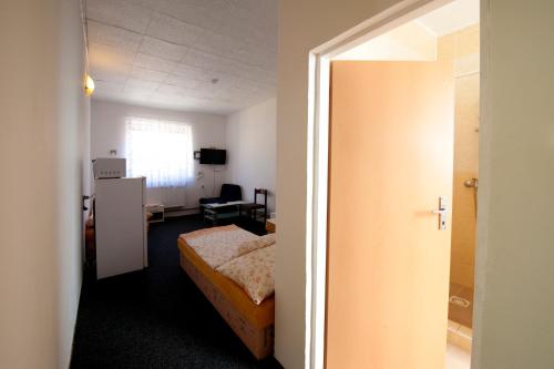 Postel nebo postele na pokoji v ubytování Hotel u Nádraží Lanžhot