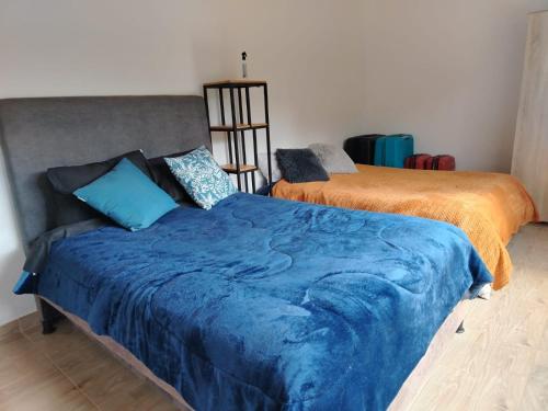 Una cama o camas en una habitación de Gaia Lodge