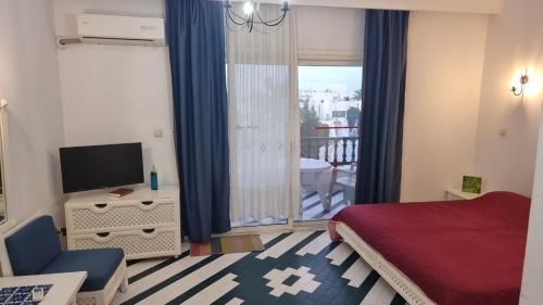 Katil atau katil-katil dalam bilik di Kantaoui apartment rental