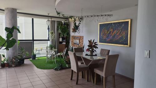 a dining room with a table and chairs at Desk and Dream Room in Panama City