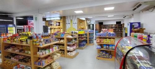 a store filled with lots of different types of food at Prim Hotel Vichayito in Vichayito