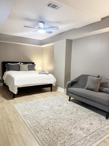 a bedroom with a bed and a couch at 1BR Oasis Escape in SE Atlanta in Atlanta