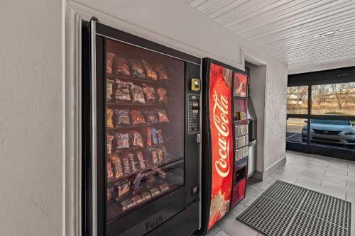 a vending machine filled with soda and coke at Motel 6 Lester - Philadelphia Airport in Lester