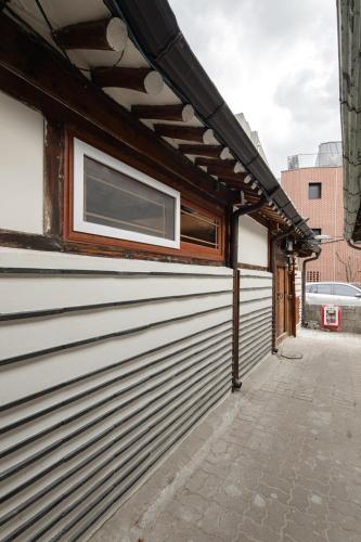 a building with a window on the side of it at Sabrina at Hanok in Seoul