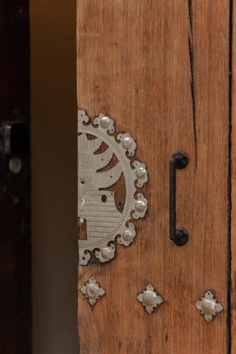 a wooden door with a metal door knocker on it at Sabrina at Hanok in Seoul