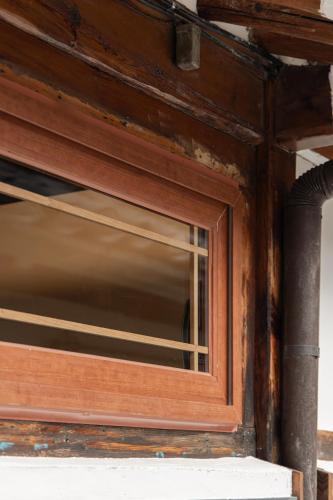 a wooden window on the side of a building at Sabrina at Hanok in Seoul