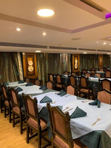 a conference room with tables and chairs in it at الباخرة نايل كروز in Cairo