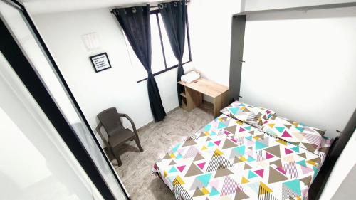Una cama o camas en una habitación de San Luis Apartamento 202 Cúcuta