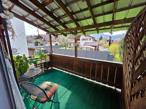 a swimming pool on the balcony of a house at Ferienwohnung Erika in Marquartstein