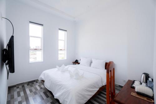 Uma cama ou camas num quarto em Bona Hotel