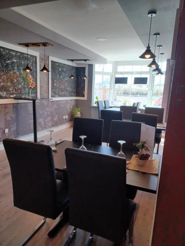 a dining room with a table and chairs at The Watling Inn in Nuneaton