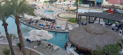 an overhead view of a swimming pool at a resort at Medano Beach suite in Cabo San Lucas