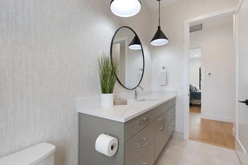 a bathroom with a sink and a mirror at Luxury Desert Oasis in Kanab Near Zion Family in Kanab