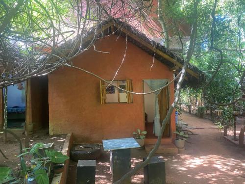 a small house in the middle of a forest at Hotel Hideaway Garage in Dambulla