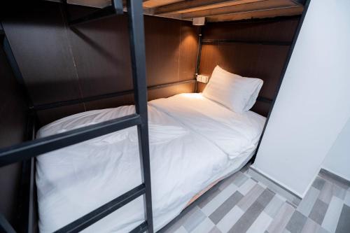 Uma cama ou camas num quarto em Bona Hotel