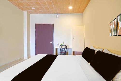 Ένα ή περισσότερα κρεβάτια σε δωμάτιο στο Hotel O Air Stop