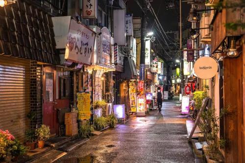 a street at night in an asian city at Tokyo Kitasen 4 in Tokyo