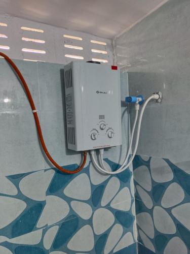 a wii game system on a wall in a room at Sithaphal tree villa in Hospet