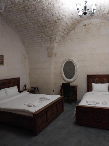 Ένα ή περισσότερα κρεβάτια σε δωμάτιο στο ORPHEUS OTEL-Konak