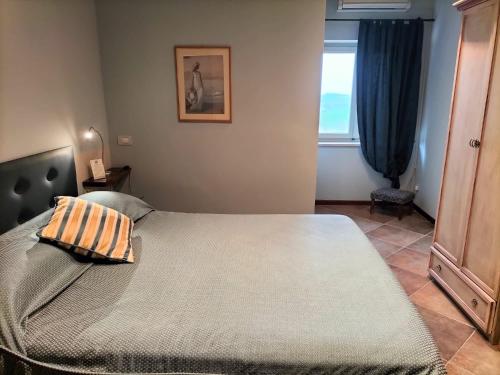 Tenuta MONVILLONE Country House & Restaurantにあるベッド