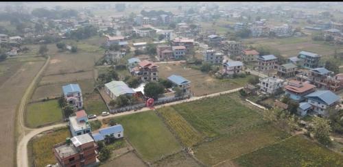 an aerial view of a village with houses at Chitwan Comforts Apt 2 in Nārāyangarh