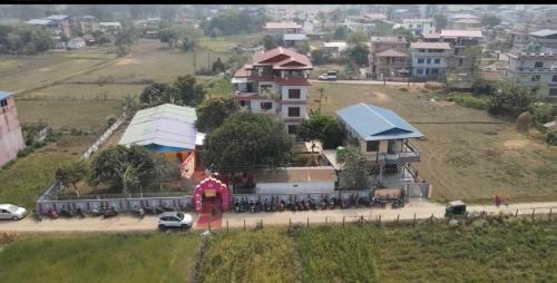 a group of motorcycles parked in front of a building at Chitwan Comforts Apt 2 in Nārāyangarh