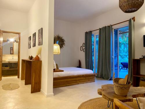 a bedroom with a bed and a large window at Luxury Lions Villas Zanzibar - with Private Cook&Infinity Pools in Kiwengwa